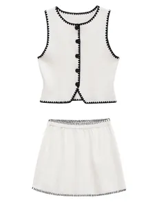 Elegant women's two-piece knitted set featuring contrast scalloped trim vest and mini skirt
