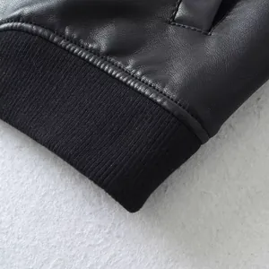 Close-up of black faux leather motorcycle jacket with premium ribbed knit elastic cuff