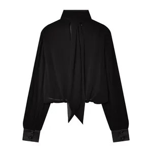 Elegant black tie-neck blouse featuring long sleeves and sophisticated button cuffs.