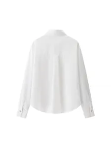 Back view of elegant white satin blouse with gold cuff buttons and back box pleat detail