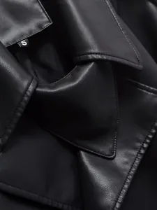 Detail view of a black faux leather jacket featuring a classic lapel and fine stitching