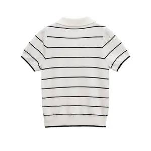 Back view of a women's short-sleeve knit striped polo shirt in white and black.