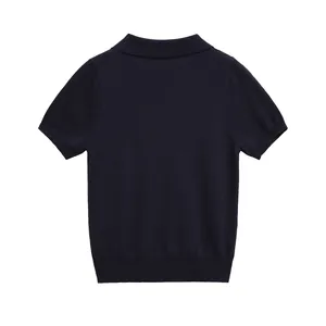 Back view of a classic navy blue short-sleeved knit Polo shirt with ribbed cuffs.