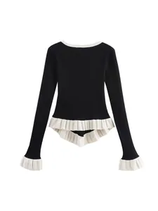 Elegant black V-neck long sleeve knit sweater featuring white ruffled hem and cuffs