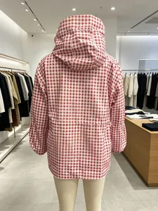 Back view of red and white gingham hooded windbreaker jacket in retro style.