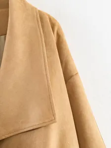 Detailed view of the soft faux suede texture and wide lapel of a khaki autumn jacket