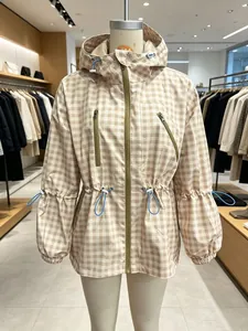 Stylish beige and white checkered hooded windbreaker jacket displayed on a mannequin