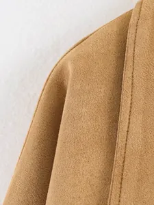 Detailed macro shot of premium khaki faux suede fabric texture on a casual jacket seam