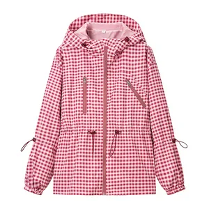 Detailed view of a pink and white gingham hooded windbreaker jacket with drawstrings.