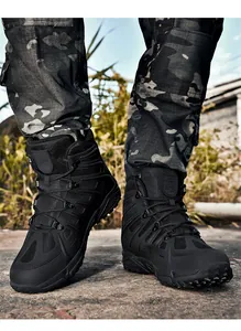 Durable black high-top tactical hiking boots for men in a rugged outdoor setting