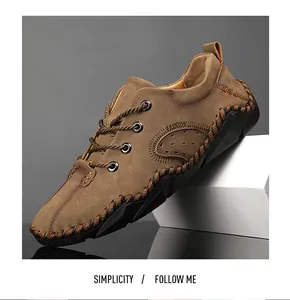 Vue latérale de chaussure décontractée en cuir marron à lacets avec coutures contrastées