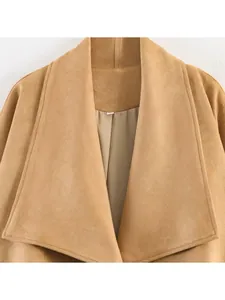 Detailed close-up of a camel faux suede women jacket with wide lapels and smooth lining