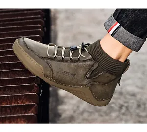 Detailed side view of men's vintage high-top Martin boots with elastic drawstrings.