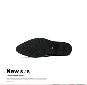 Detail view of the textured anti-slip sole on a stylish black leather dress shoe for men.