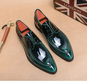 Detailed view of emerald green patent leather pointed-toe dress shoes with lace-up style