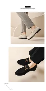 Detail view of stylish men's suede loafers with gold buckle in black and beige