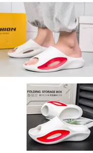 Vista detallada de chanclas blancas con suela gruesa y detalles rojos para hombres