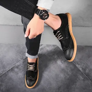 Classic vintage British style black men's brogue shoes with durable tan rubber sole