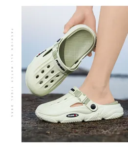 Close-up of sage green men's breathable clogs with adjustable strap