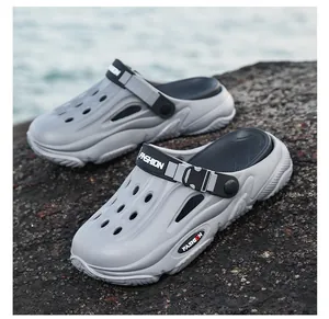 Detailed macro view of grey men's outdoor clogs with breathable holes and strap.