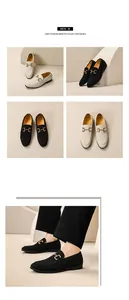 Detail view of men's slip-on loafers in black and beige with gold buckle accents