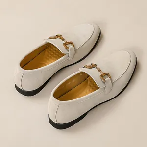 Elegant men's beige suede loafers with gold-tone horsebit buckle detail and slip-on style