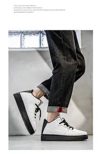Side view of men's white and black low-top casual skate shoes with black soles