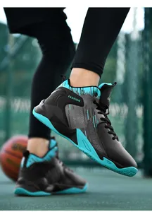 Teenagers outdoor mid-top basketball shoes in black and cyan leather finish on court