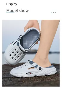 Close-up showing the detail of white breathable outdoor clogs with fashion strap