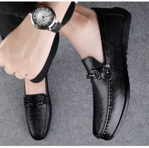 Detailed visual of black leather business casual loafers with metal buckle for men