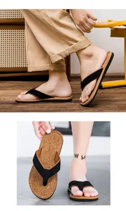 Close-up detail of men's thong sandals featuring cork-textured footbeds and black fabric straps