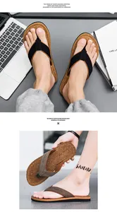 Detail view of men's thong sandals with cork texture footbed and fabric straps