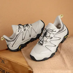 Men's stylish beige outdoor hiking shoes with thick soles and quick-lace system.
