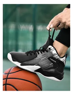 Close-up of black and white high-top basketball shoes with durable leather upper