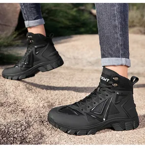Detail of durable black mid-top tactical hiking boots with rugged anti-slip soles