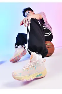 Close-up of stylish color-block high-top basketball shoes with thick soles for men.