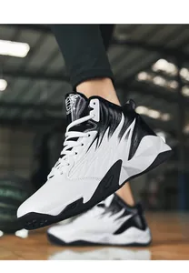 Zapatillas de baloncesto para hombre de caña media con diseño de bloques en blanco y negro