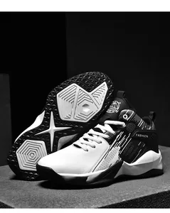Detail view of mid-top leather basketball shoes showing durable anti-slip sole pattern.