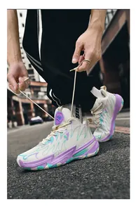 Detailed view of white contrast color basketball shoes with purple and blue patterns.