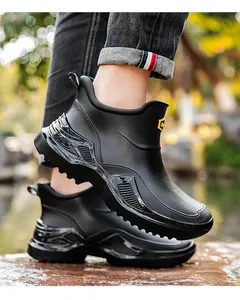 Detailed view of men's waterproof short rain boots with thick anti-slip soles
