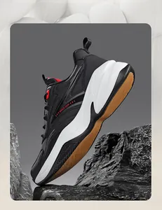 Detailed view of black chunky running sneakers with leather upper on rock props