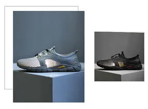 Gedetailleerd overzicht van de ademende mesh hardloopschoenen in grijs en zwart.