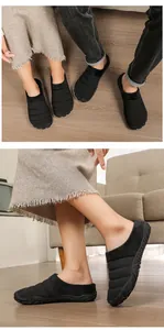 Detailed side and top views of black fleece-lined warm winter house slippers
