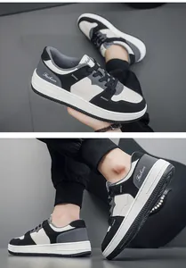 Gedetailleerd overzicht van modieuze herensneakers in zwart-wit met vetersluiting