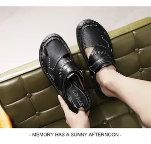 Casual men's black leather cutout breathable sandals shown on a green sofa