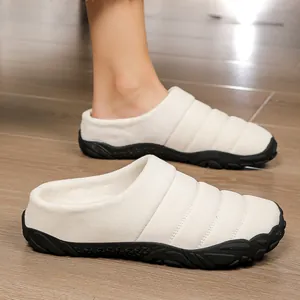 Warm winter fleece-lined indoor slippers with quilted white upper and black rubber sole