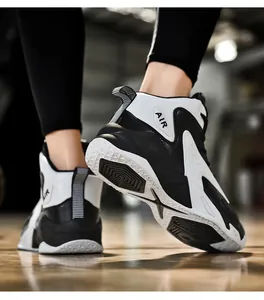 Detail view of men's high-top basketball shoes with thick sole and leather texture