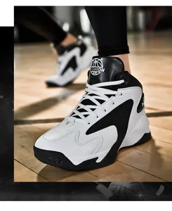 Detailed shot of high-top basketball sneakers featuring contrast black and white leather