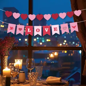 Close-up of Valentine's Day heart garland and LOVE banner in a romantic setting