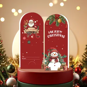 Vista detallada de tarjetas navideñas festivas con diseños de Papá Noel y un muñeco de nieve